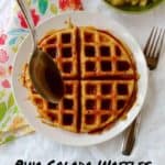pina colada waffles with rum sauce being drizzled over it, with pineapple on the side - pin for pinterest
