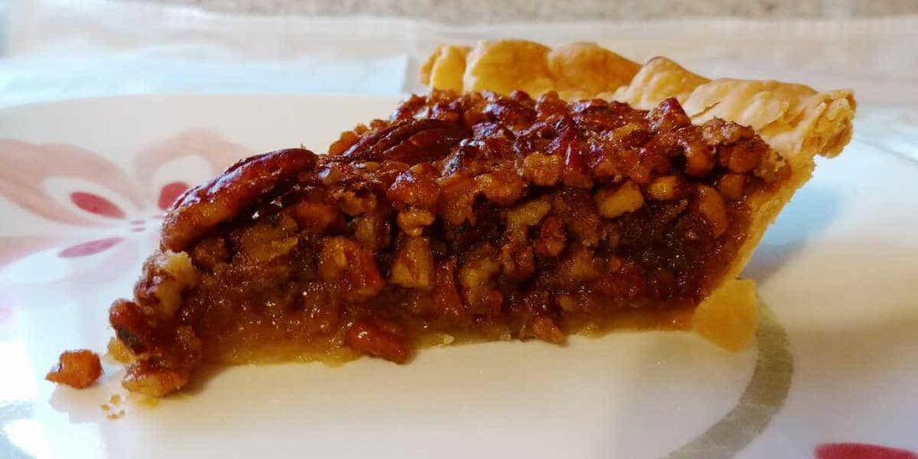 a slice of pecan pie on a plate