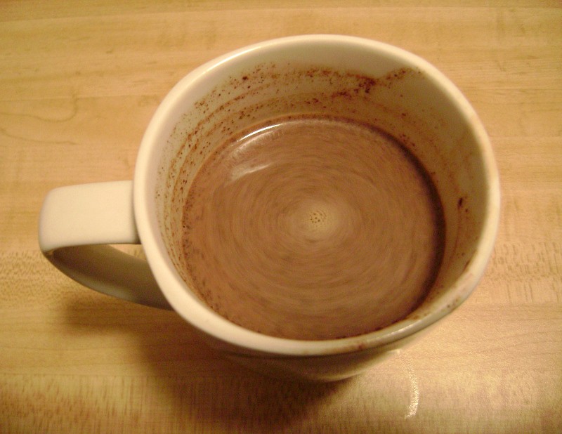 monster hot chocolate mix from king arthur flour, swirling with milk in a mug