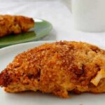 fresh apple cinnamon scones, on plates with a mug in the background