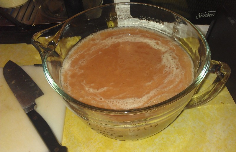 a large pitcher of puree for peach bellinis