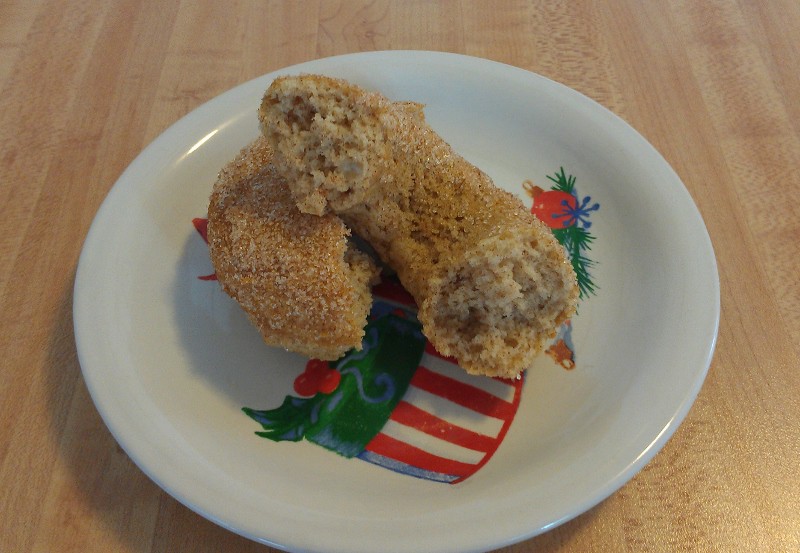 gluten-free baked donuts, in half on a plate