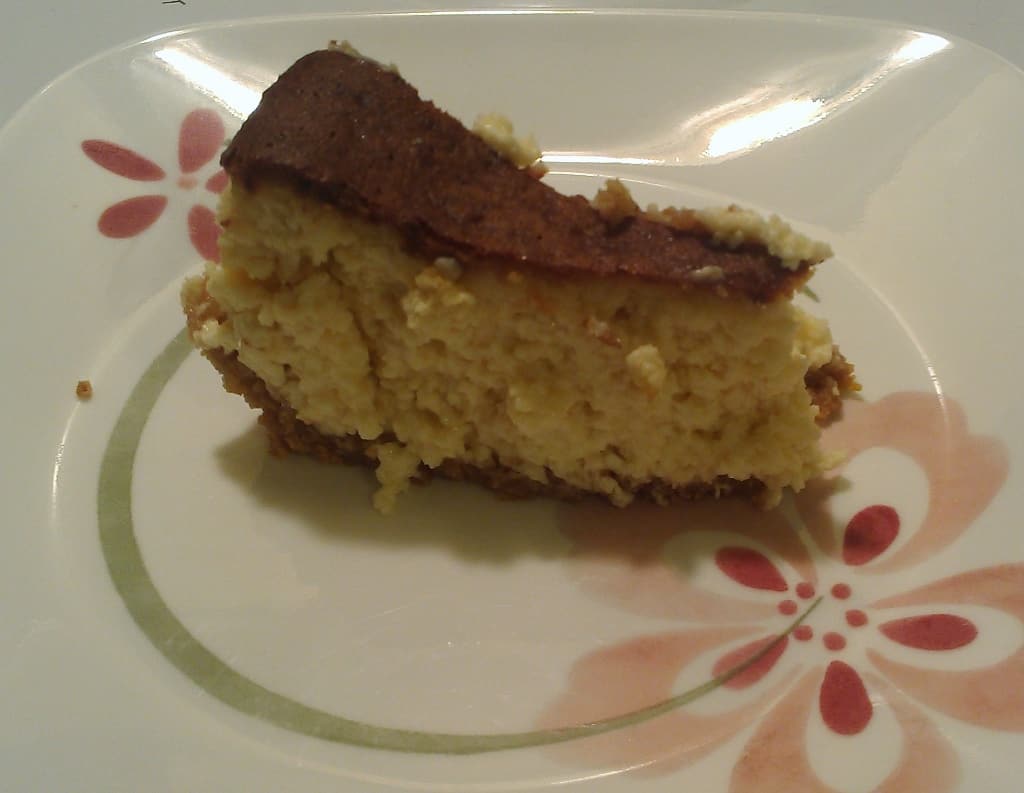 a slice of honey bourbon cheesecake, on a plate