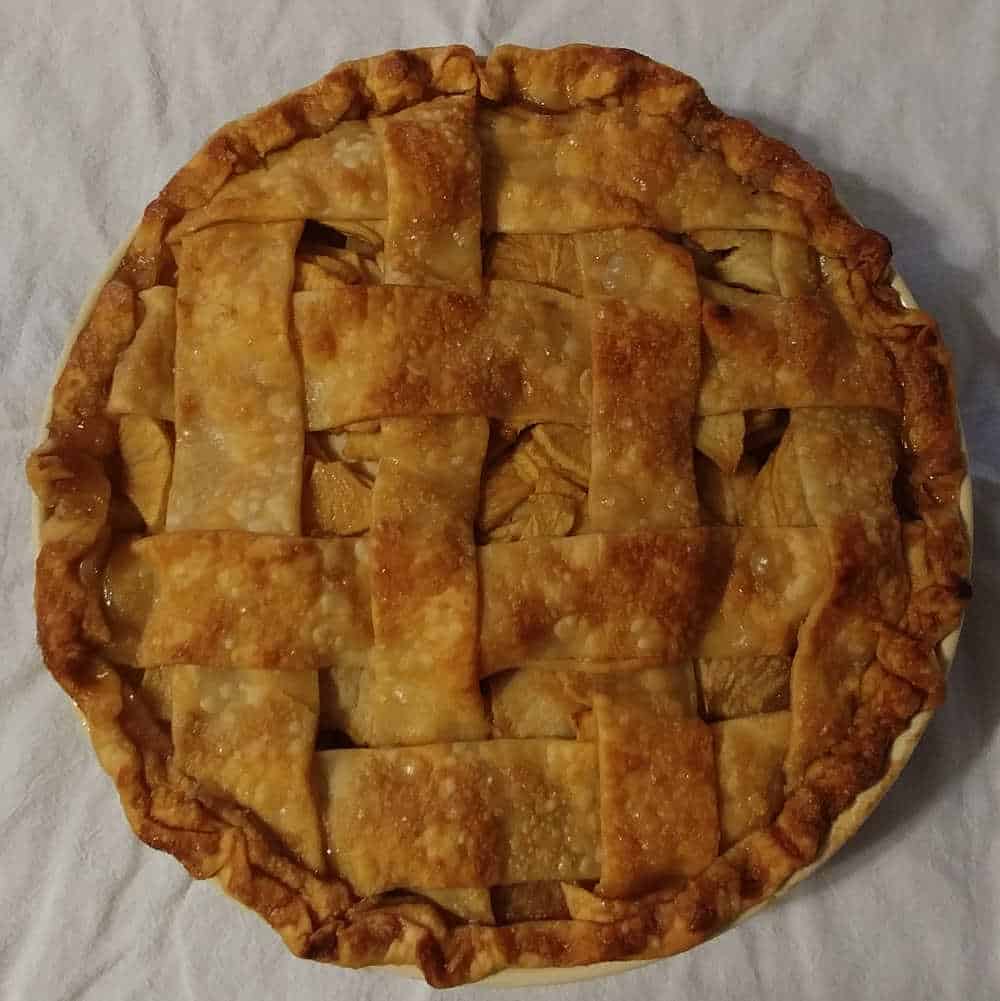 caramel apple pie, topped with lattice crust and baked