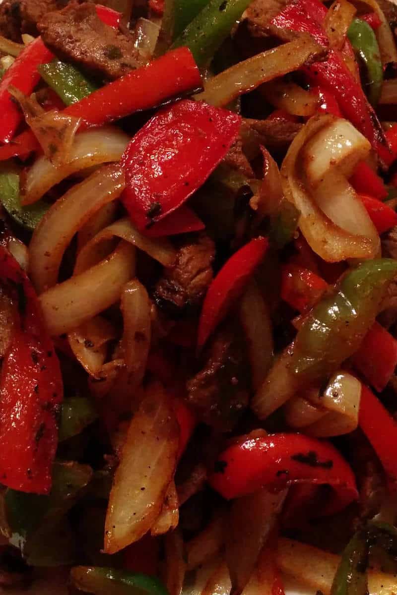 beef fajitas, with onions and red and green bell peppers