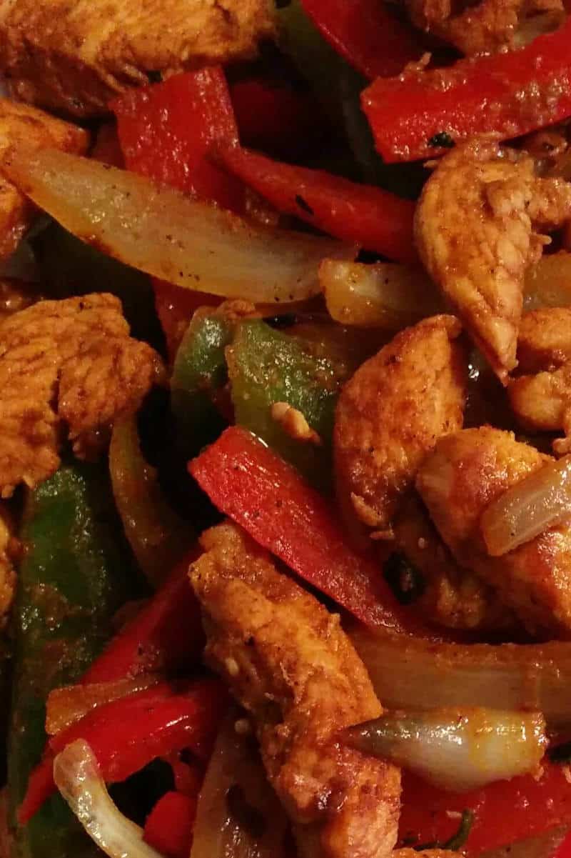 chicken fajitas, with onions and red and green bell peppers