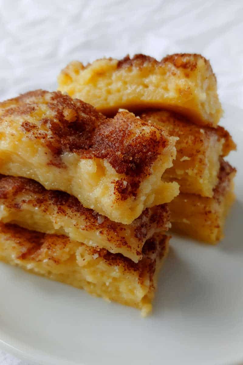 cinnamon gooey butter cake, cut into small bars and stacked on top of each other