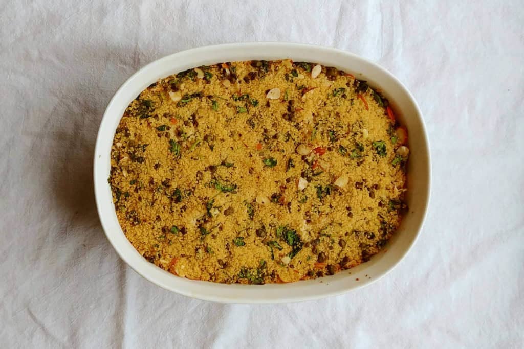 salmon with baked couscous, in a casserole dish after being baked