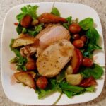 fennel-crusted pork loin with potatoes and pears, on salad