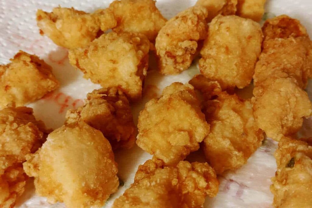 Japanese fried chicken (tori no karaage), deep fried and draining on a paper towel