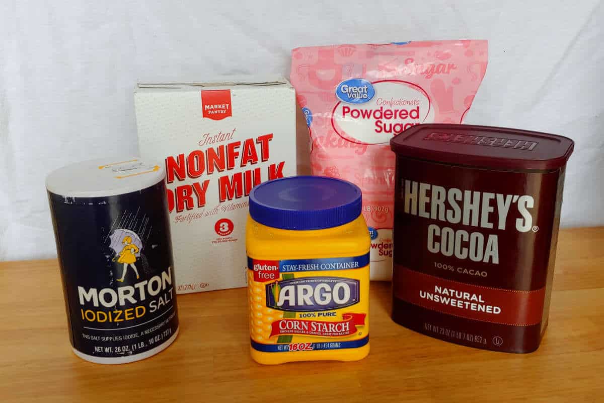 ingredients for Alton Brown's hot cocoa mix - powdered milk, powdered sugar, salt, cornstarch, and cocoa powder
