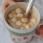 alton brown's hot cocoa mix, stirred with boiling water, with marshmallows, in a mug