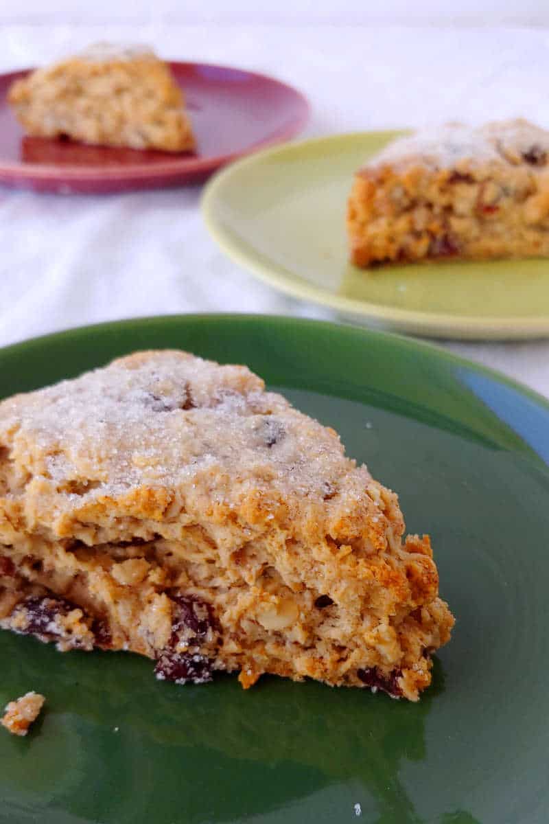 cranberry oat pecan scones, on red and green plates