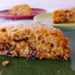 cranberry oat pecan scones, on three red and green plates