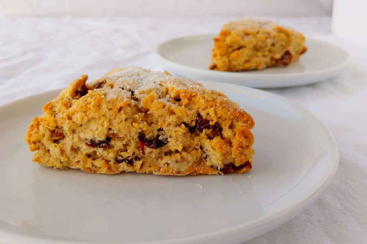 cranberry oat pecan scones, on white plates