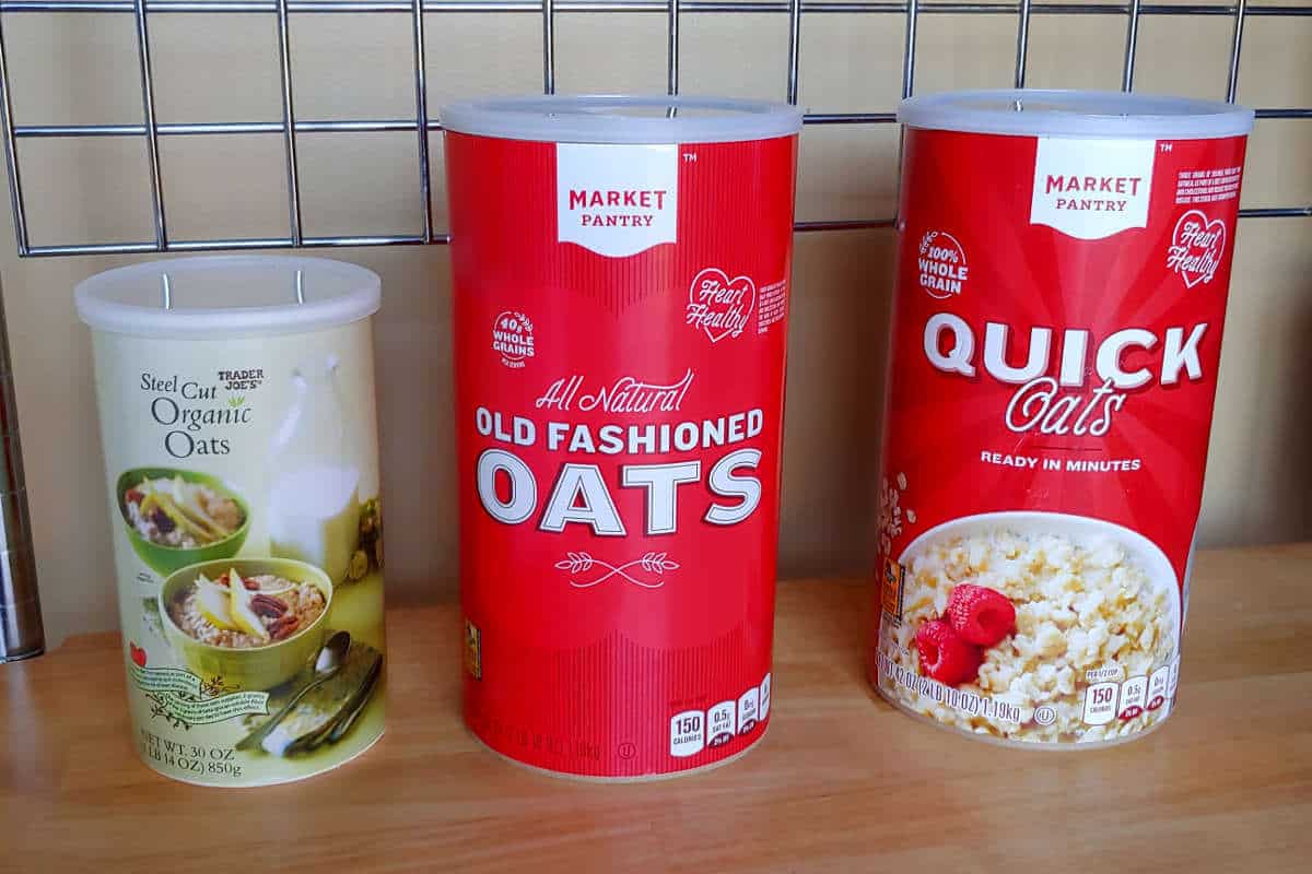 canisters of steel-cut oats, old fashioned oats, and rolled oats, side by side