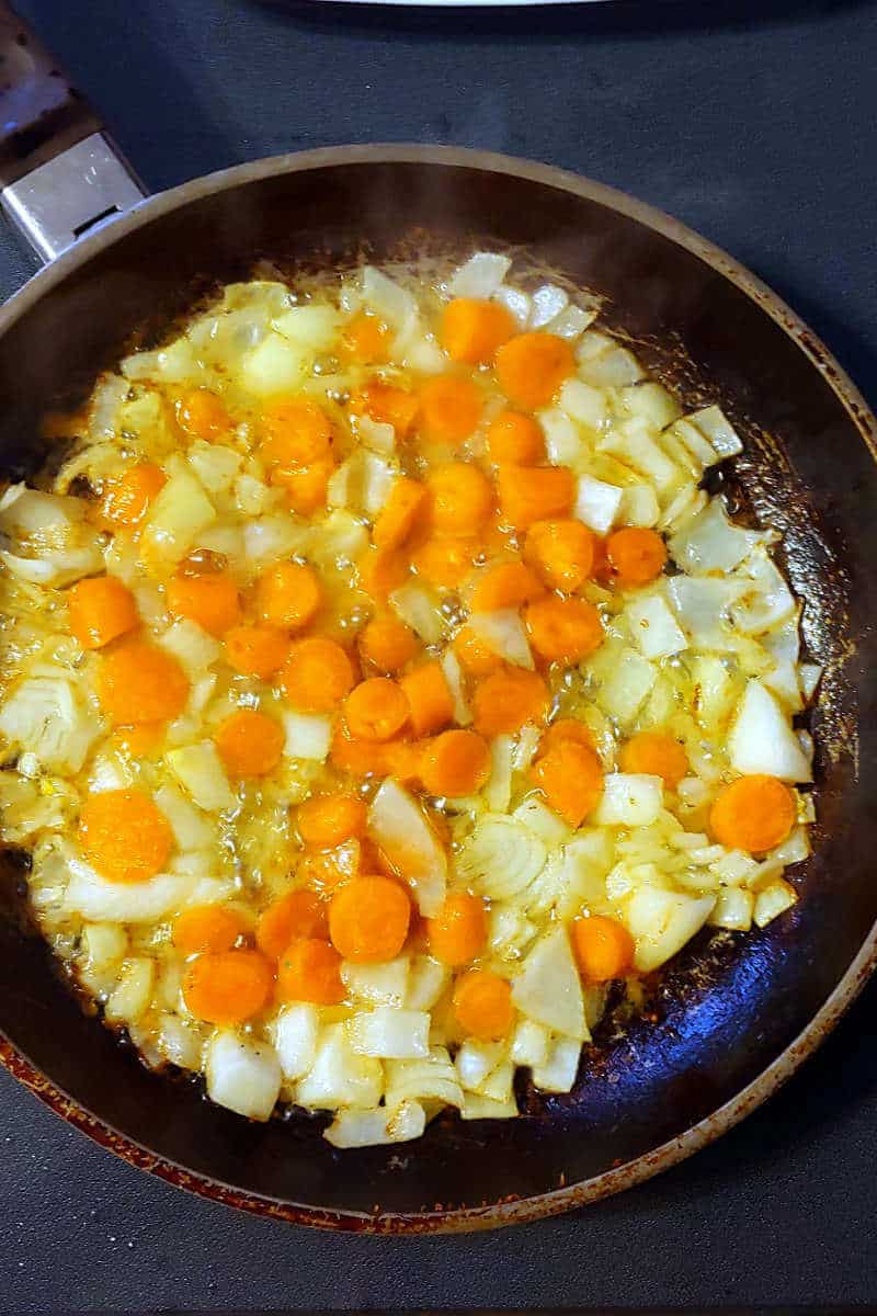 sauteed onion and carrots, in a skillet