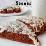 double chocolate scones, on a plate with a mug in the background - pin for Pinterest