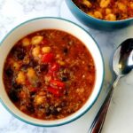 a bowl of mexican soup, with a spoon