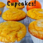 vegan orange cupcakes, on a wire rack, with oranges in the background - pin for Pinterest