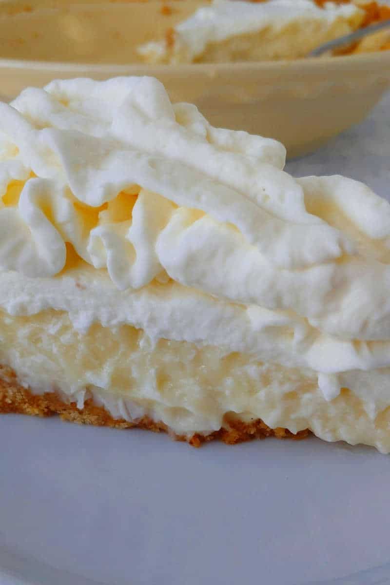 a close up of coconut cream pie with whipped cream