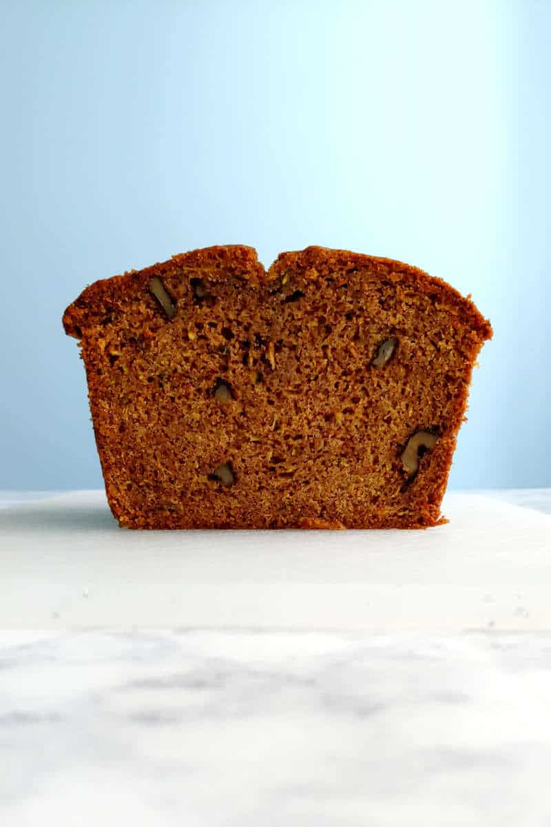 a loaf of zucchini bread, cut and seen from the side