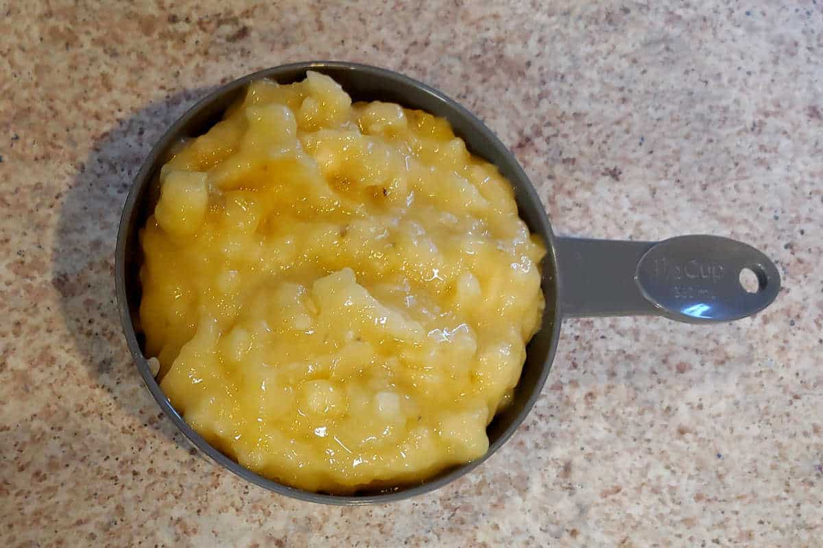 mashed banana in a measuring cup