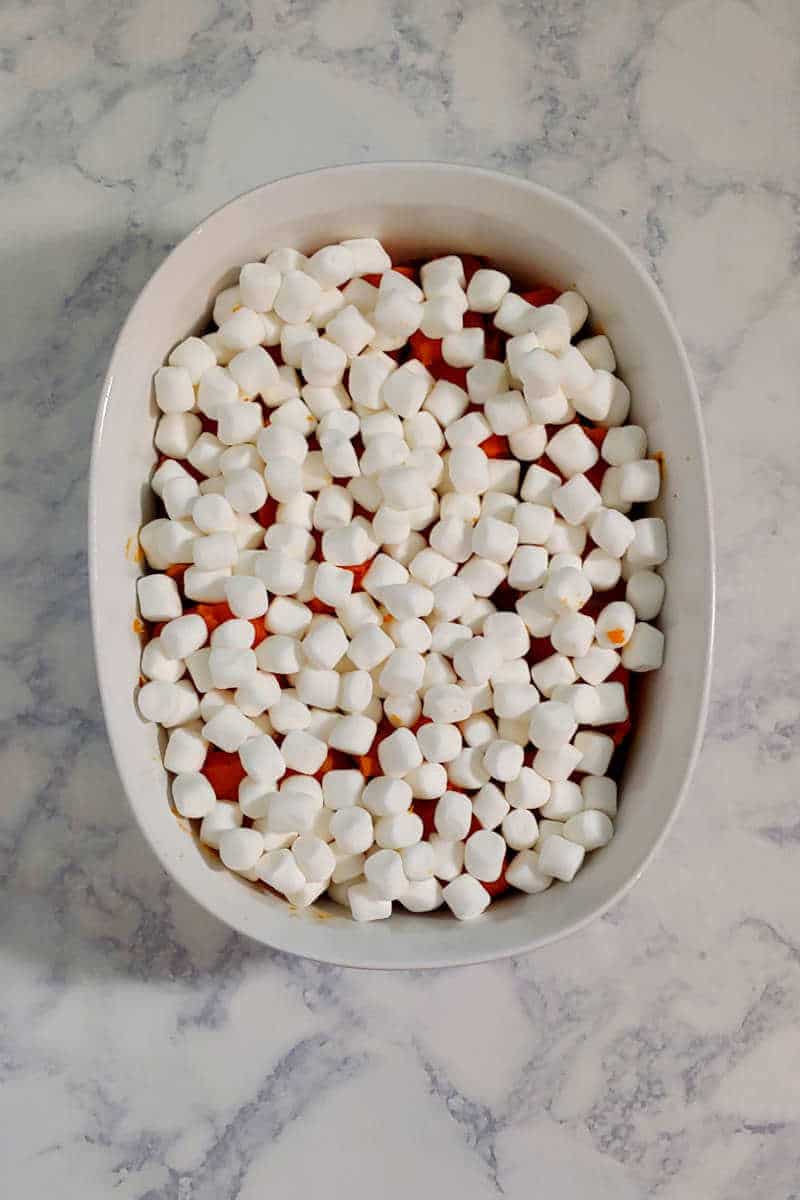 roasted sweet potatoes, cut and in a baking dish, topped with marshmallows