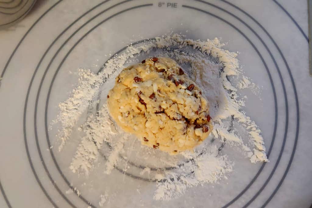 a ball of scone dough on a floured surface