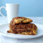 triple cinnamon scones, on a plate, with a mug of coffee