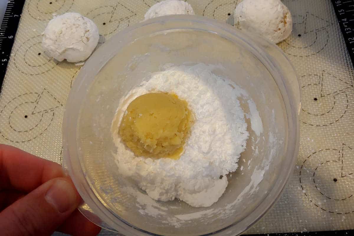 a ball of dough, plopped into powdered sugar