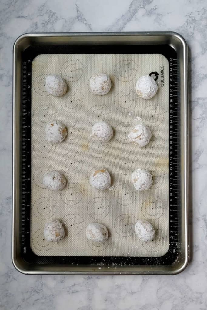 rounded gooey butter cookie dough, on a baking sheet