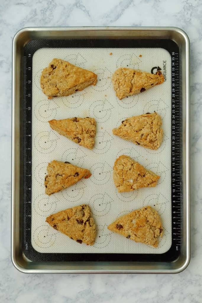 chocolate chip cookie scones, separated and baked on a baking sheet