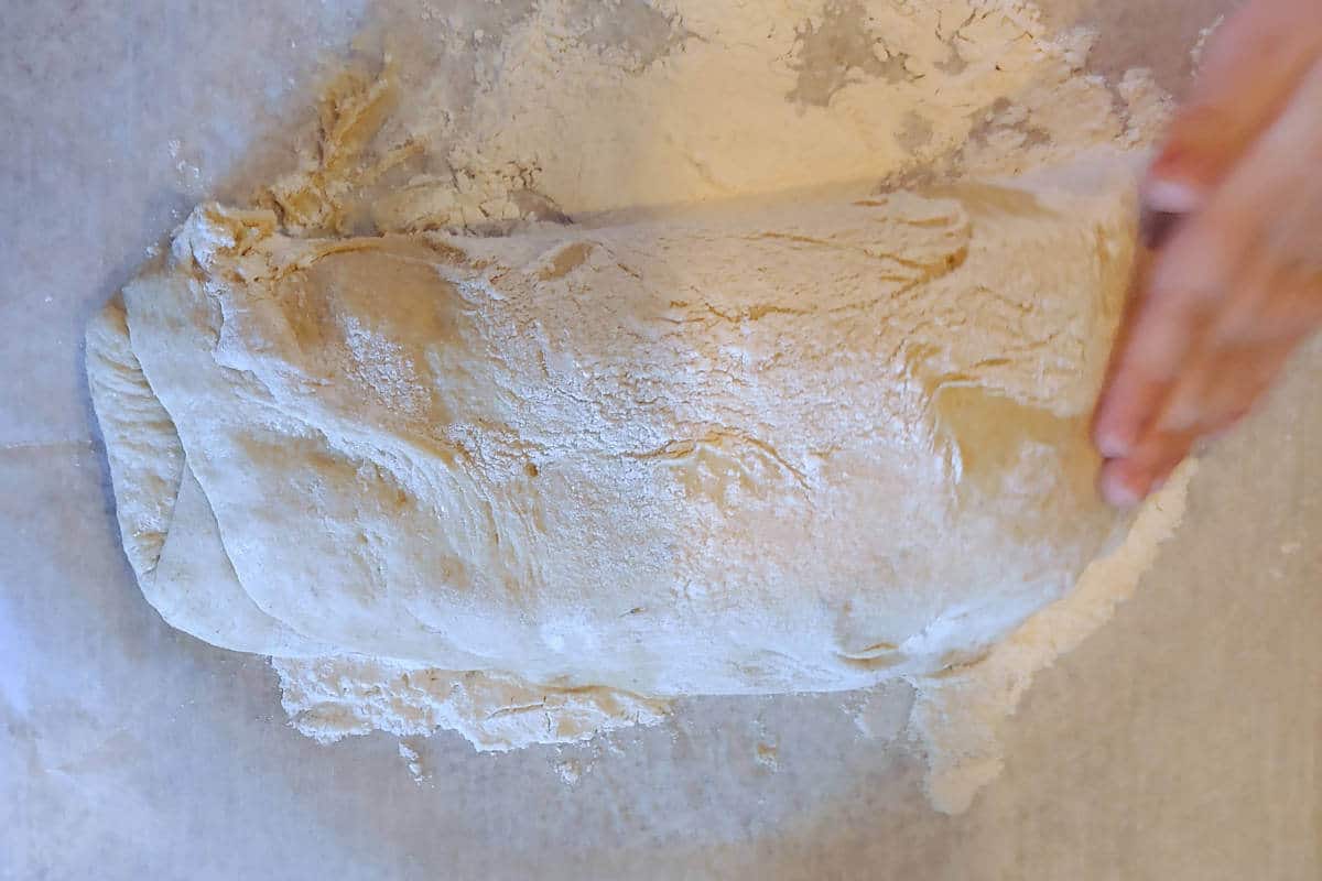 bread dough, having been folded in a trifold like a letter