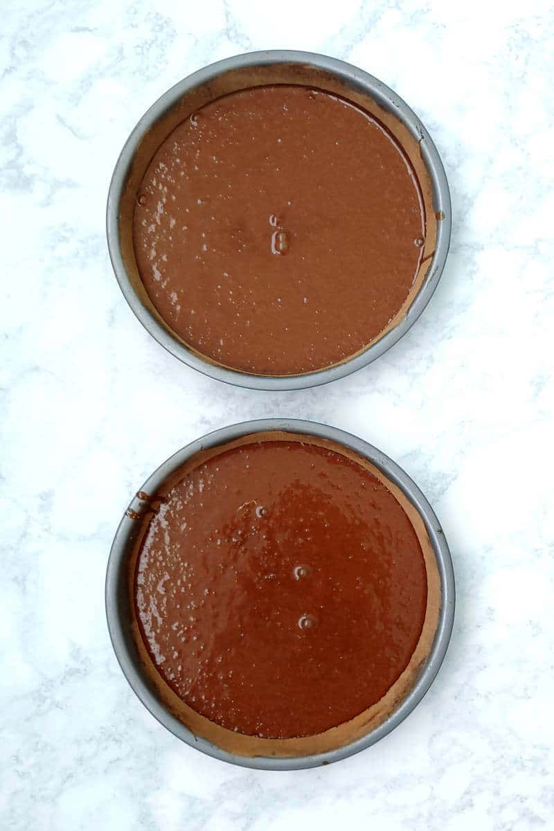 chocolate cake batter in 2 pans