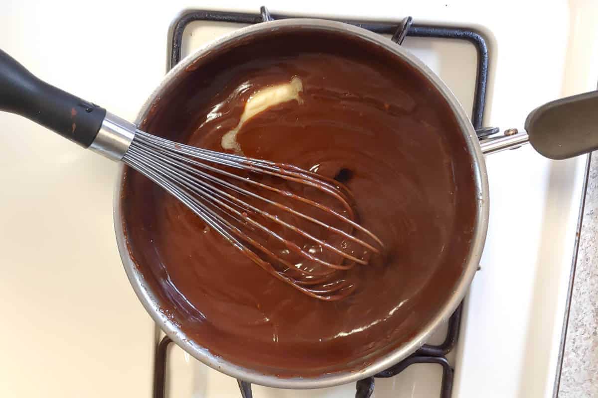 stirring butter into cooked filling