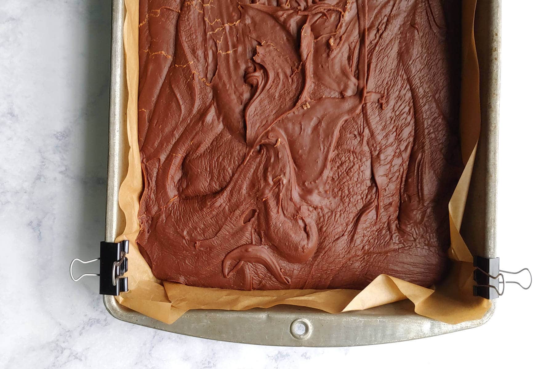 fudge swirled in the prepared pan