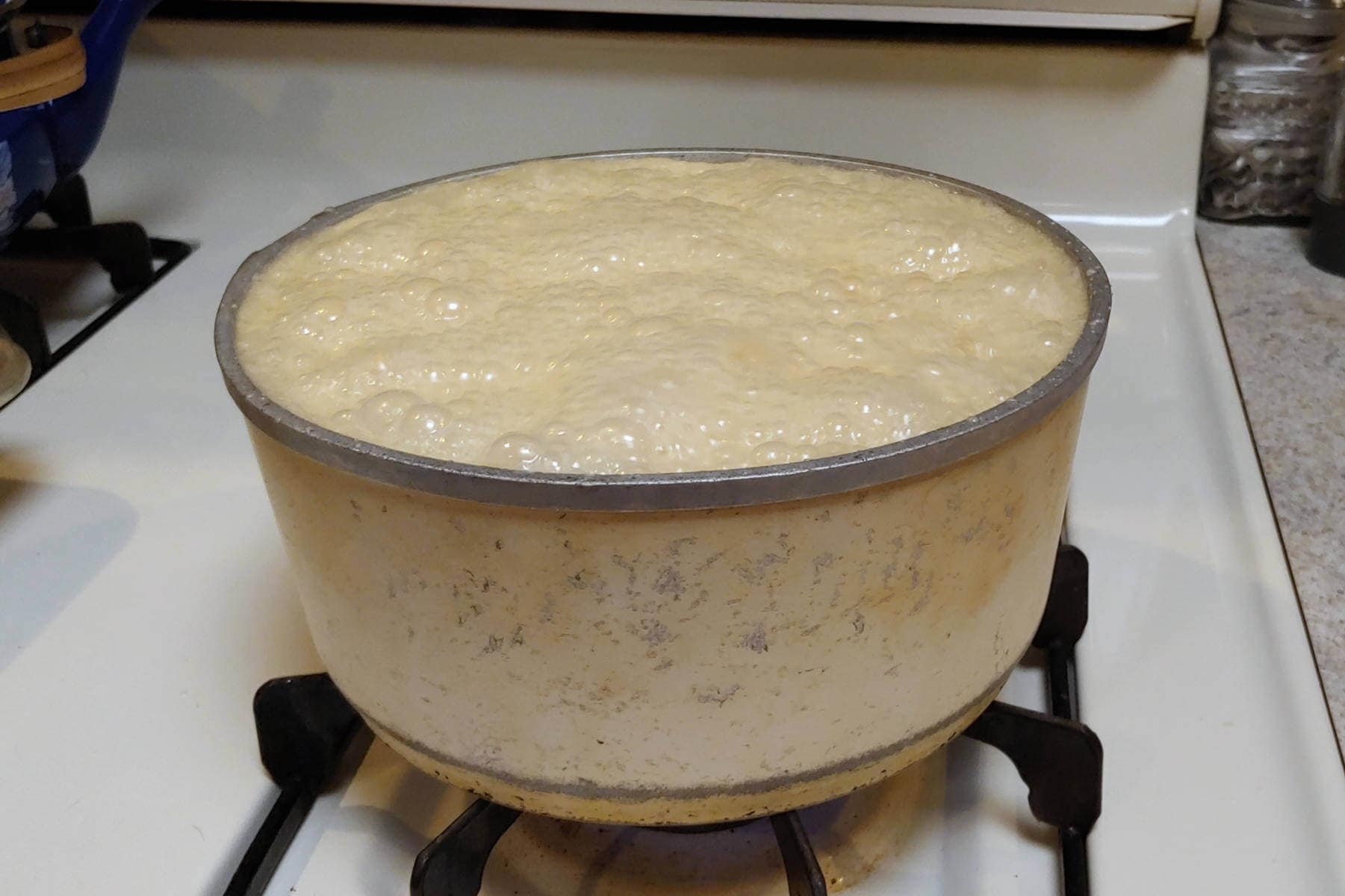 boiling syrup close to top of pot