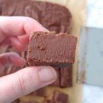 close up of square of fudge held in hand
