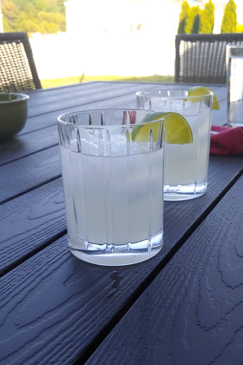 two margaritas with lime garnish