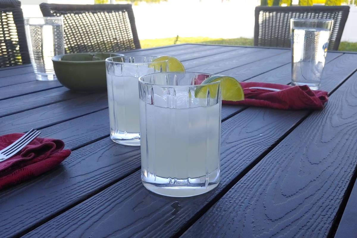 two margaritas on a table outside