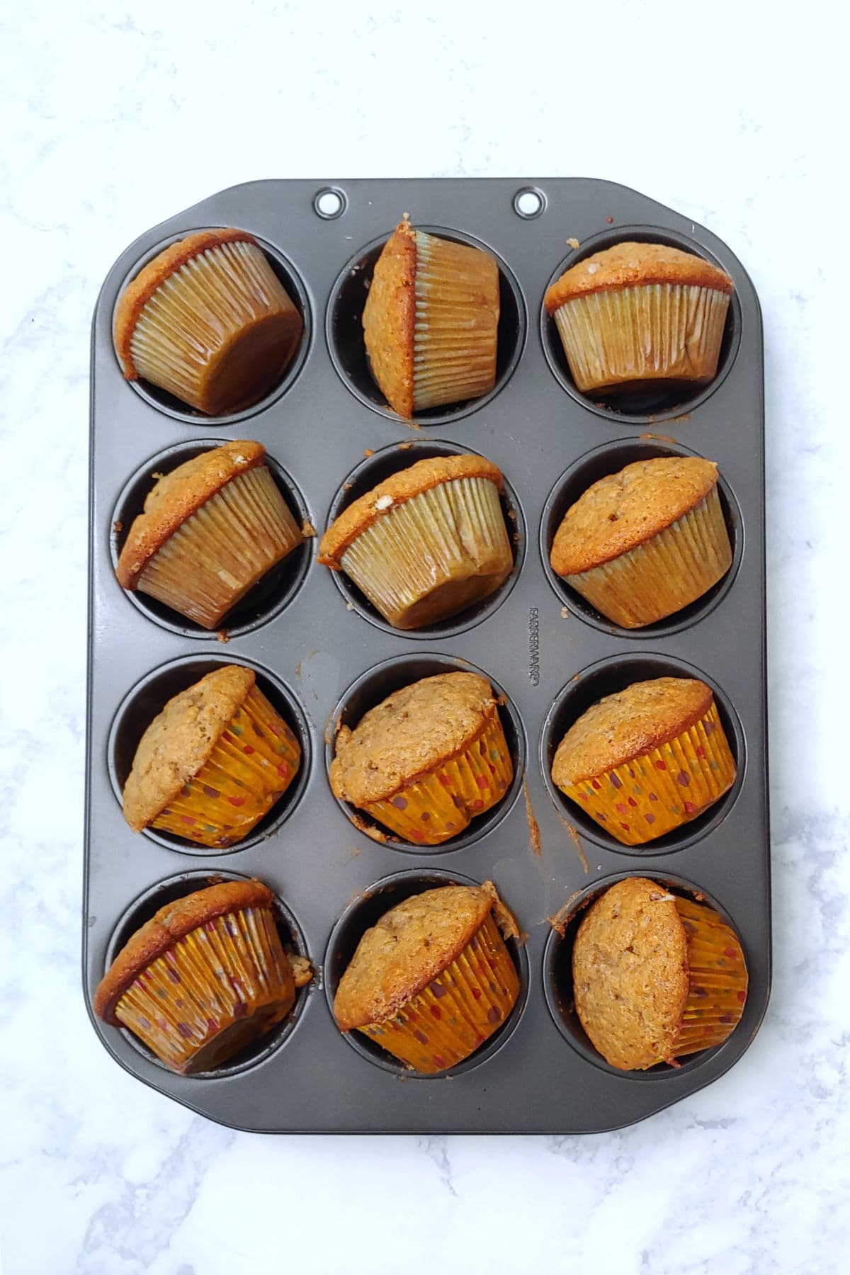 cupcakes, cooling on their sides, in the muffin tin