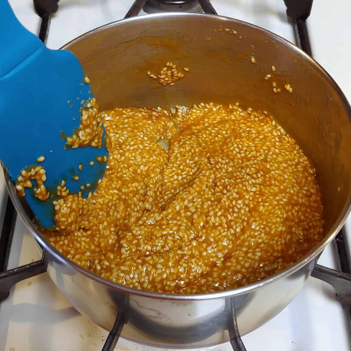sesame seeds cooking in candy syrup