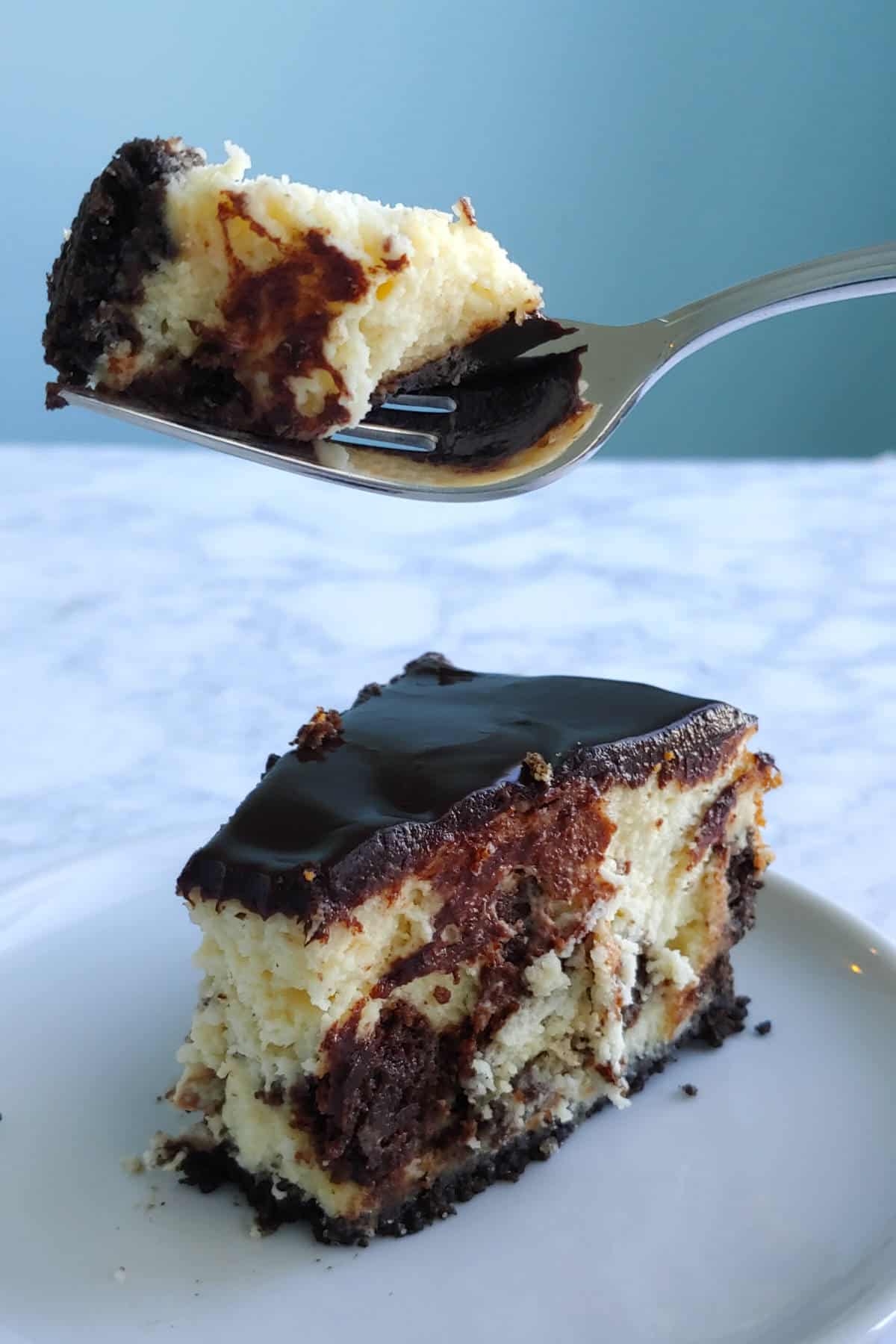 bite of brownie cheesecake on a fork