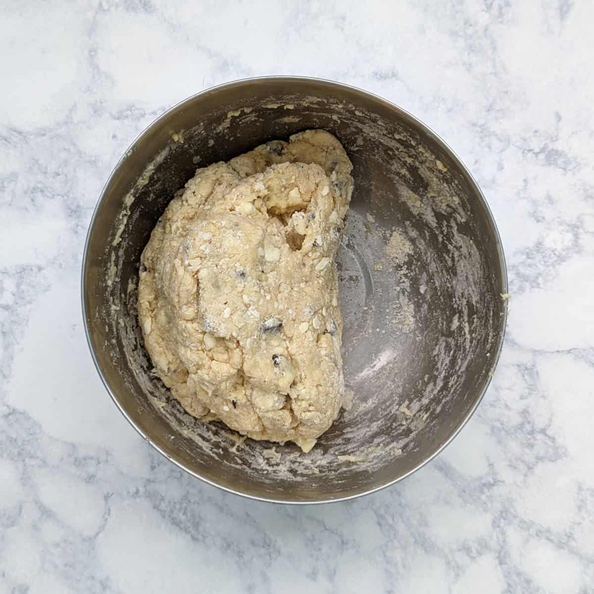 scone dough folded in half in the process of kneading