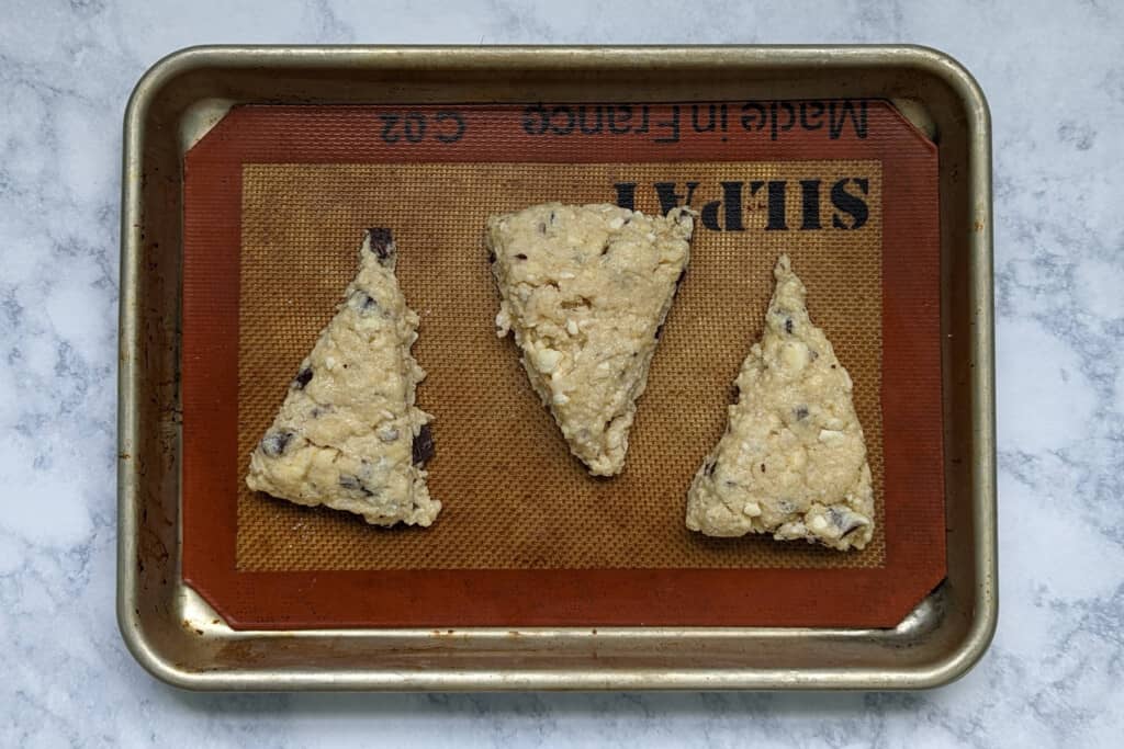 scone wedges, on a baking sheet, before baking