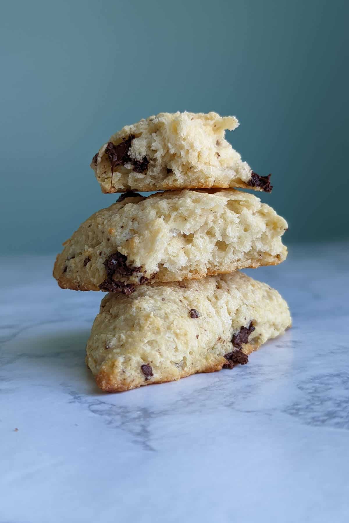 chocolate orange scones, in a stack, broken open to see texture