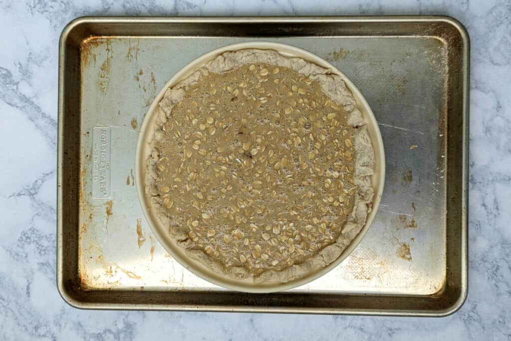 black bottom oatmeal pie, unbaked, on a baking sheet