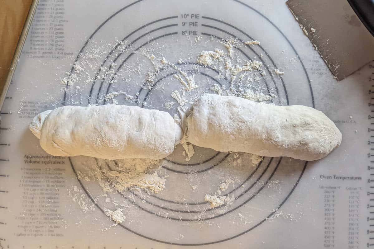 both balls of dough, shaped into rough, squat loaves