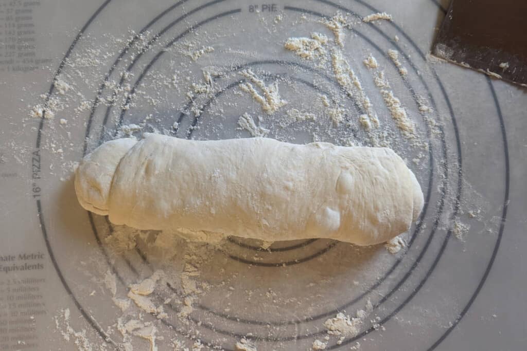 one half of the dough, rolled and extended into a loaf 12 inches long